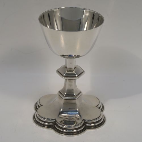 A very handsome Antique Sterling Silver altar chalice, having a plain round tapering cup, a middle hexagonal baluster, and sitting on a spreading hexafoil foot. This elegant silver chalice was made by Goldsmiths and Silversmiths of London in 1914. The dimensions of this fine hand-made antique silver chalice are height 12.5 cms (5 inches), diameter at lip 7.5 cms (3 inches), and with a weight of approx. 173g (5.6 troy ounces).   