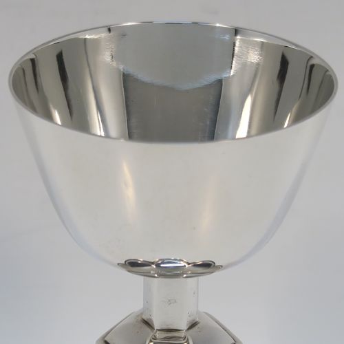A very handsome Antique Sterling Silver altar chalice, having a plain round tapering cup, a middle hexagonal baluster, and sitting on a spreading hexafoil foot. This elegant silver chalice was made by Goldsmiths and Silversmiths of London in 1914. The dimensions of this fine hand-made antique silver chalice are height 12.5 cms (5 inches), diameter at lip 7.5 cms (3 inches), and with a weight of approx. 173g (5.6 troy ounces).