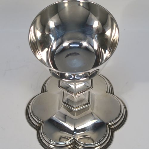 A very handsome Antique Sterling Silver altar chalice, having a plain round tapering cup, a middle hexagonal baluster, and sitting on a spreading hexafoil foot. This elegant silver chalice was made by Goldsmiths and Silversmiths of London in 1914. The dimensions of this fine hand-made antique silver chalice are height 12.5 cms (5 inches), diameter at lip 7.5 cms (3 inches), and with a weight of approx. 173g (5.6 troy ounces).