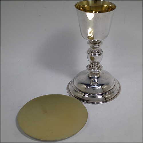 A very handsome Sterling Silver altar chalice and paten, having a plain round tapering cup with a gold-gilt interior, a middle plain round stepped baluster, sitting on a round stepped pedestal foot, and a matching plain round paten with the upper side gold-gilt. The chalice made by J. S. Harman of London in 1933, and the paten made by G.M.B. of London in 1972. The dimensions of this fine hand-made silver chalice and paten are height of chalice 16 cms (6.25 inches), diameter of paten 11.5 cms (4.5 inches), and with a total weight of approx. 330g (10.6 troy ounces).
