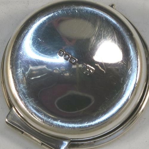 A large and very handsome Sterling Silver Pyx box, having a plain round body with an applied reeded top border, a hinged lid with a hand-chased Cruciform Christogram, a ring-handle and thumb-piece, and a gold-gilt interior. This elegant silver pyx box was made by A. R. Mowbray and Co. Ltd., of London in 1946. The dimensions of this fine hand-made silver Pyx box are diameter 5 cms (2 inches), depth 1.5 cms (0.6 inches), and it weighs approx. 31g (1 troy ounce).