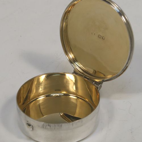 A large and very handsome Sterling Silver Pyx box, having a plain round body, a hinged lid with a hand-engraved Christogram over a cross, a gold-gilt interior, and a clasp with ring handle. This elegant sterling silver Pyx box was made by A. R. Mowbray of London in 1960. The dimensions of this fine hand-made silver Pyx box are diameter 4.5 cms (1.75 inches), depth 2 cms (0.8 inches), and it weighs approx. 33g (1 troy ounce).