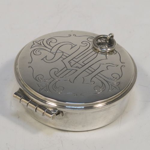 A large and very handsome Sterling Silver Pyx box, having a plain round body, a hinged lid with a hand-engraved Christogram over a cross, a gold-gilt interior, and a clasp with ring handle. This elegant sterling silver Pyx box was made by A. R. Mowbray of London in 1960. The dimensions of this fine hand-made silver Pyx box are diameter 4.5 cms (1.75 inches), depth 2 cms (0.8 inches), and it weighs approx. 33g (1 troy ounce).