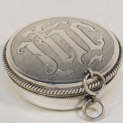 A large and handsome Sterling Silver Pyx box, having a round body with applied rope-twist borders, a hinged lid with a hand-engraved Christogram, a gold-gilt interior, and with a pair of ring handles. This elegant silver pyx box was made by A. R. Mowbray and Co. Ltd., of London in 1934. The dimensions of this fine hand-made large silver Pyx box are diameter 6.5 cms (2.5 inches), depth 2 cms (0.5 inches), and it weighs approx. 68g (2.2 troy ounces).   