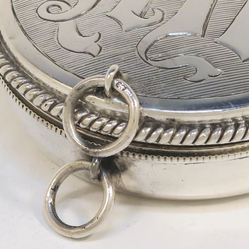 A large and handsome Sterling Silver Pyx box, having a round body with applied rope-twist borders, a hinged lid with a hand-engraved Christogram, a gold-gilt interior, and with a pair of ring handles. This elegant silver pyx box was made by A. R. Mowbray and Co. Ltd., of London in 1934. The dimensions of this fine hand-made large silver Pyx box are diameter 6.5 cms (2.5 inches), depth 2 cms (0.5 inches), and it weighs approx. 68g (2.2 troy ounces).
