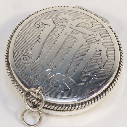 A large and handsome Sterling Silver Pyx box, having a round body with applied rope-twist borders, a hinged lid with a hand-engraved Christogram, a gold-gilt interior, and with a pair of ring handles. This elegant silver pyx box was made by A. R. Mowbray and Co. Ltd., of London in 1934. The dimensions of this fine hand-made large silver Pyx box are diameter 6.5 cms (2.5 inches), depth 2 cms (0.5 inches), and it weighs approx. 68g (2.2 troy ounces).