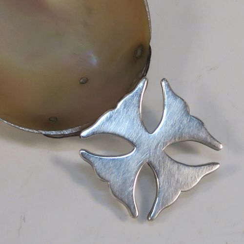 A rare and very pretty Antique Edwardian Sterling Silver and Mother-of-Pearl Anointing or Baptismal holy water Shell, having a silver handle pinned to a shell scoop, all in original very good condition with no damage to the mother-of-pearl. This beautiful baptism or anointing shell was made in London in 1910. The dimensions of this fine hand-made Baptism or Anointing Shell are length 12 cms (4.75 inches), and width 5.5 cms (2.25 inches).
