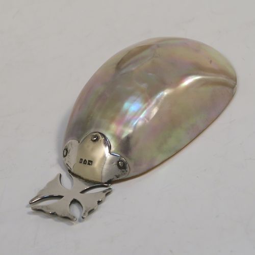 A rare and very pretty Antique Edwardian Sterling Silver and Mother-of-Pearl Anointing or Baptismal holy water Shell, having a silver handle pinned to a shell scoop, all in original very good condition with no damage to the mother-of-pearl. This beautiful baptism or anointing shell was made in London in 1910. The dimensions of this fine hand-made Baptism or Anointing Shell are length 12 cms (4.75 inches), and width 5.5 cms (2.25 inches).