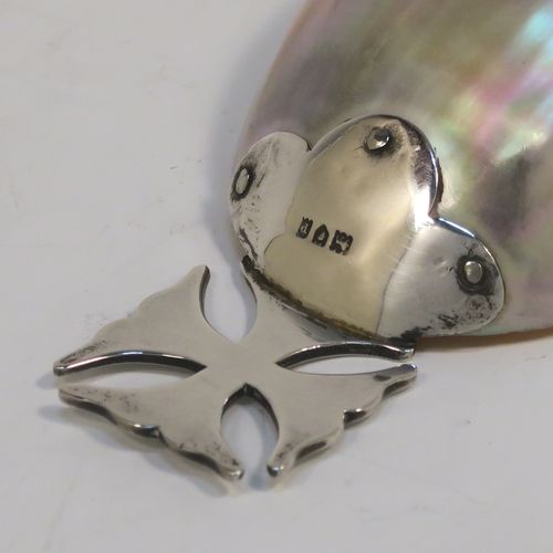 A rare and very pretty Antique Edwardian Sterling Silver and Mother-of-Pearl Anointing or Baptismal holy water Shell, having a silver handle pinned to a shell scoop, all in original very good condition with no damage to the mother-of-pearl. This beautiful baptism or anointing shell was made in London in 1910. The dimensions of this fine hand-made Baptism or Anointing Shell are length 12 cms (4.75 inches), and width 5.5 cms (2.25 inches).