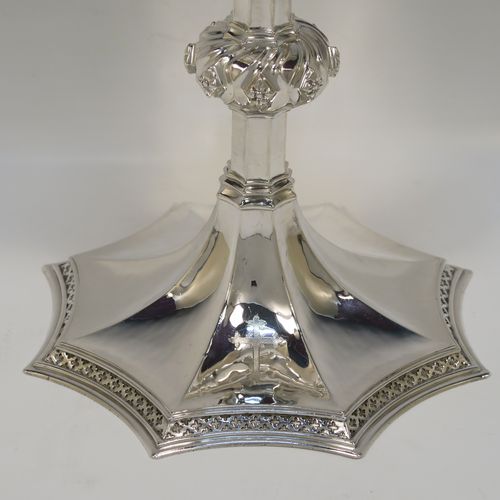 A large and handsome Sterling Silver altar chalice having a hand-hammered or planished finish, with a round tapering cup and a gold-gilt interior, an octagonal panelled stem with a central applied jewel-like baluster, and all sitting on a spreading octagonal panelled base with an applied fleur-de-lis border. This beautiful and impressive silver altar chalice was made made by A. R. Mowbray and Co., Ltd., of London in 1948. The dimensions of this fine hand-made silver chalice are height 20 cms (8 inches), diameter at lip of cup 10 cms (4 inches), spread across base 15 cms (6 inches), and it weighs approx. 444g (14.3 troy ounces).
