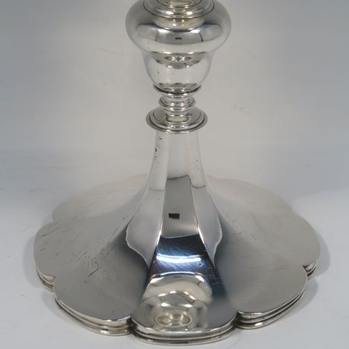 A large and handsome Antique early Victorian Sterling Silver chalice, having a plain round tapering body with a gold-gilt interior and an applied reeded top border, a stem with a round middle baluster, and sitting on a spreading panelled octofoil pedestal foot. This large and beautiful silver chalice was made by Robert Hennell III of London in 1842. The dimensions of this fine hand-made antique silver chalice are height 24.5 cms (9.75 inches), diameter at lip 10 cms (4 inches), and it weighs approx. 451g (14.5 troy ounces).   