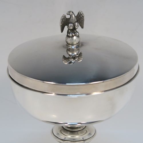 A very handsome Sterling Silver Ciborium, having a plain round body with a gold-gilt interior, sitting on a matching pedestal foot with central baluster, and a lift-off lid with a cast eagle finial. This elegant silver ciborium was made by A. R. Mowbray and Co. Ltd., of London in 1965. The dimensions of this fine hand-made silver ciborium are height 15 cms (6 inches), diameter of cup 11.5 cms (4.5 inches), and the cup weighs approx. 332g (10.7 troy ounces).   