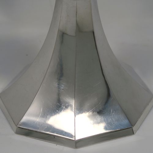 A very stylish Art Deco Sterling Silver altar chalice having a round hand-hammered or planished tapering cup, a panelled stem with four central applied red garnet coloured cabochon jewels, and all sitting on a spreading octagonal panelled base. This beautiful silver altar chalice was made made by J L A of London in 1936. The dimensions of this fine hand-made Art Deco silver chalice are height 21 cms (8.25 inches), diameter at lip of cup 8.5 cms (3.3 inches), spread across base 11 cms (4.3 inches), and it weighs approx. 365g (11.7 troy ounces).