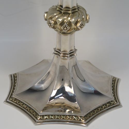 A large and handsome Sterling Silver altar chalice, with a round tapering cup and a gold-gilt interior, an octagonal panelled stem with a central applied jewel-like baluster (which is also gold-gilt), and all sitting on a spreading octagonal panelled base with an applied gold-gilt cross-style border. This beautiful silver altar chalice was made made by Vanpoulles of London in 1975. The dimensions of this fine hand-made silver chalice are height 18 cms (7 inches), diameter at lip of cup 11 cms (4.3 inches), spread across foot 13 cms (5 inches), and it weighs approx. 412g (13.3 troy ounces).