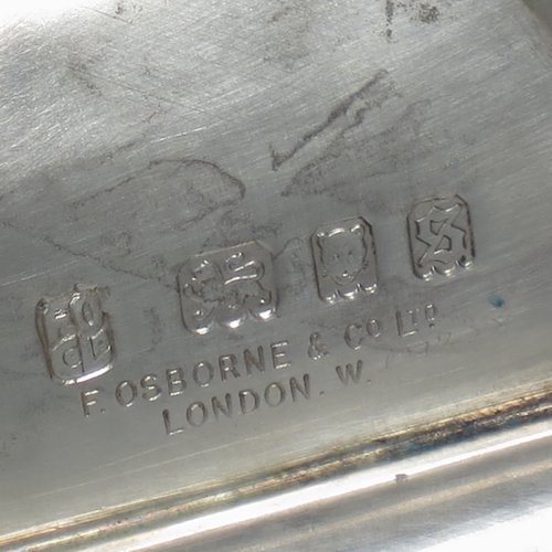 A Sterling Silver Chalice having a round body with a hand-hammered finish, a hexagonal pedestal foot with a central baluster, having applied bead borders, a gold-gilt interior, and a hand-chased crucifix. Made by Frederick Osbourne of London in 1933. The dimensions of this fine hand-made chalice are height 20 cms (8 inches), diameter at lip 10 cms (4 inches), and it weighs approx. 682g (22 troy ounces).