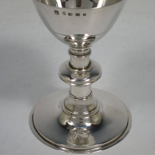 A handsome Antique Victorian Sterling Silver altar chalice and paten, having a plain round tapering cup, a middle plain round stepped baluster, sitting on a round stepped pedestal foot, and a matching plain round paten. Made by J. Sherwood and Sons of Birmingham in 1868. The dimensions of this fine hand-made antique silver chalice and paten are height of chalice 12.5 cms (5 inches), diameter of paten 11.5 cms (4.5 inches), and with a total weight of approx. 252g (8 troy ounces).