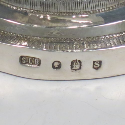 An Antique Victorian Irish Sterling Silver altar chalice and paten, having a plain round tapering cup with gold-gilt interior, a panelled column with a middle baluster, and a spreading pedestal foot, all hand-chased and engraved with floral & geometrical work, together with a plain round gold-gilt paten. Made by Samuel Le Bass of Dublin in 1863/64. The dimensions of this fine hand-made antique silver chalice & paten are height 21.5 cms (8.5 inches), diameter at base 15 cms (6 inches), and it weighs approx. 395g (12.7 troy ounces).   