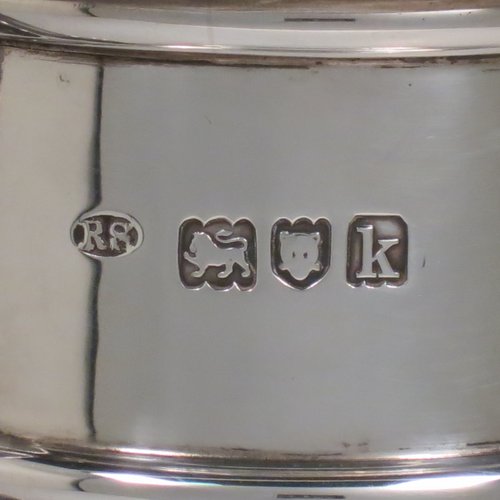 An Antique Edwardian Sterling Silver ecclesiastical wine / water flagon, having a plain baluster body with applied bands, together with a hinged domed lid with a Celtic style cross finial, a plain sparrow-beak spout, a scroll handle, and sitting on a spreading hexafoil foot. Made by Robert Stebbings of London in 1905. The dimensions of this fine hand-made antique silver flagon are height 31 cms (12.25 inches), length 16 cms (6.25 inches), and it weighs approx. 897g (29 troy ounces).