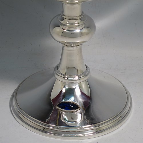 A Sterling Silver Ciborium, having a plain round body, sitting on a matching pedestal foot with an applied oval dark blue cabochon stone, with reeded borders, and a lift-off lid with cruciform finial. Made by Frederick Osborne & Co., of Birmingham in 1930. The dimensions of this fine hand-made silver ciborium are height 20 cms (8 inches), diameter of cup 9.5 cms (3.75 inches), and it weighs a total of approx. 385g (12.5 troy ounces).