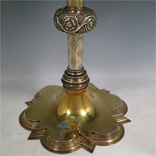 An Antique Victorian Sterling Silver and gold-gilt Monstrance, having a cruciform finial over a central Lunar receptacle in an elaborate sun-ray frame with eight applied winged angels, all mounted on a pedestal foot with hand-chased vine-leaf central knop over a hexafoil base. All decorated with 39 old cut foil-backed diamonds (one missing), 15 pearls of good lustre and uneven shape, a blue-enamelled Lunar surround engraved with the Latin Sanctus repeated, and 27 set turquoise stones. Made by John Harman & Co., of Birmingham in 1899. The dimensions of this fine hand-made antique silver and gold-gilt Monstrance are height 68 cms (26.75 inches), width 29 cms (11.5 inches), depth 25.5 cms (10 inches), and it weighs approx. 2,800g (90 troy ounces). Please note that the overall total estimated diamond weight is 5.5 carats).