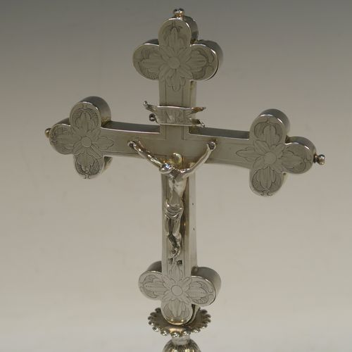 A beautiful Antique early 18th century (possibly late 17th century) continental Sterling Silver altar table cross, showing Christ on the cross and INRI above, with hand-engraved and chased floral decoration. Made in ca 1700 possibly in the city of Breslau (ex-Germany), now Wroclaw (Poland). The dimensions of this fine hand-made antique silver altar cross are height 27 cms (10.75 inches), width 13.5 cms (5.3 inches), with a total weight of approx. 292g (9.4 troy ounces).
