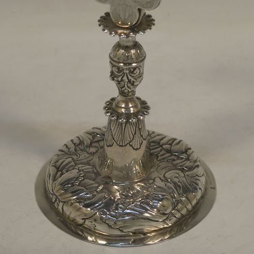 A beautiful Antique early 18th century (possibly late 17th century) continental Sterling Silver altar table cross, showing Christ on the cross and INRI above, with hand-engraved and chased floral decoration. Made in ca 1700 possibly in the city of Breslau (ex-Germany), now Wroclaw (Poland). The dimensions of this fine hand-made antique silver altar cross are height 27 cms (10.75 inches), width 13.5 cms (5.3 inches), with a total weight of approx. 292g (9.4 troy ounces).