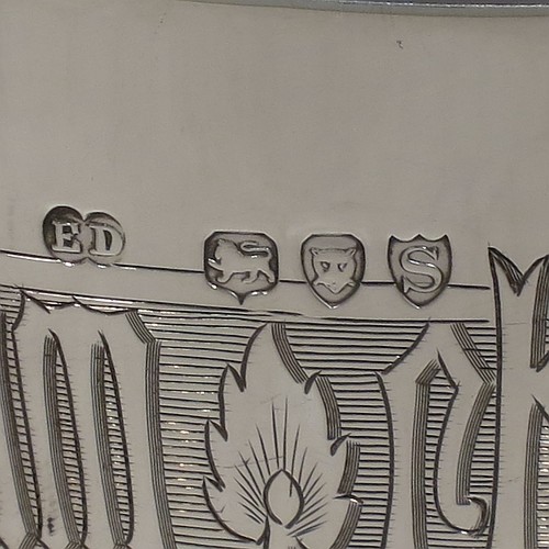 An Antique Victorian Sterling Silver pair of altar chalices, having plain round tapering cups with gold-gilt interiors and bands of hand-engraved Latin inscriptions, middle balusters with hand-chased work made to look as if mounted with six jewels, and sitting on spreading hexafoil feet with engraved Christograms. Made by Edward Dimes of London in 1893. The dimensions of this fine pair of hand-made antique silver chalices are height 20 cms (8 inches), width at base 13 cms (5 inches), and they weigh a total of approx. 778g (25 troy ounces).