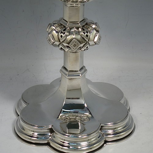 An Antique Victorian Sterling Silver pair of altar chalices, having plain round tapering cups with gold-gilt interiors and bands of hand-engraved Latin inscriptions, middle balusters with hand-chased work made to look as if mounted with six jewels, and sitting on spreading hexafoil feet with engraved Christograms. Made by Edward Dimes of London in 1893. The dimensions of this fine pair of hand-made antique silver chalices are height 20 cms (8 inches), width at base 13 cms (5 inches), and they weigh a total of approx. 778g (25 troy ounces).