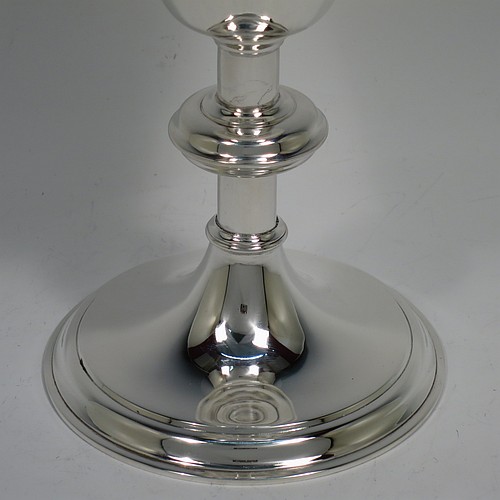 An Antique Victorian Sterling Silver altar chalice, having a plain round tapering cup with a gold-gilt interior, a round plain column with a middle baluster, and a spreading round pedestal foot with reeded border. Made by Blunt, Wray and Co., of London in 1897. The dimensions of this fine hand-made antique silver chalice are height 13 cms (5 inches), diameter of cup 8 cms (3.25 inches), and it weighs approx. 235g (7.6 troy ounces).
