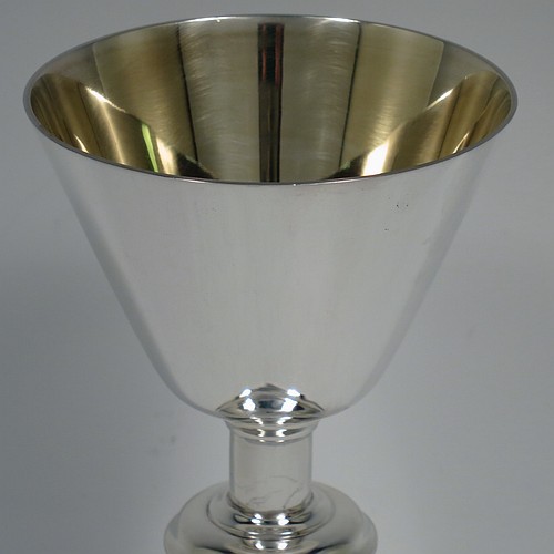 An Antique Victorian Sterling Silver altar chalice, having a plain round tapering cup with a gold-gilt interior, a round plain column with a middle baluster, and a spreading round pedestal foot with reeded border. Made by Blunt, Wray and Co., of London in 1897. The dimensions of this fine hand-made antique silver chalice are height 13 cms (5 inches), diameter of cup 8 cms (3.25 inches), and it weighs approx. 235g (7.6 troy ounces).