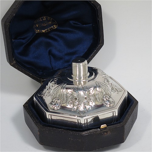 An Antique Victorian Sterling Silver very rare and unusual travelling chalice, in the shape of an octagonal shaped baptismal font, the top piece, which screws into the base, having a gold-gilt interior and hand-chased panels with anthemion leaves and angel faces, the pedestal base with matching panel work and leaves, and all in its original dark-blue satin and velvet-lined presentation box. Made by George Fox of London in 1863. The dimensions of this fine hand-made antique silver travelling chalice are height 10 cms (4 inches), diameter at top 9 cms (3.5 inches), with a total weight of approx. 172g (5.5 troy ounces).    