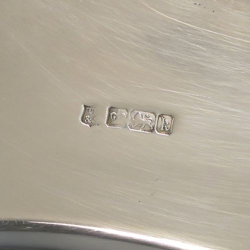 A very handsome and large Antique Edwardian Sterling Silver altar tazza dish for serving the consecrated communion wafers, having a round shaped body with a hand-engraved central Christogram and an engraved border with This Is My Body Which Is Broken For You - This Do In Remembrance Of Me, and all sitting on a plain round pedestal foot. This elegant communion tazza dish was made by Thomas Bradbury of Sheffield in 1902. The dimensions of this fine hand-made antique silver tazza communion dish are diameter 30.5 cms (12 inches), height 11.5 cms (4.5 inches), and it weighs approx. 1,095g (35 troy ounces).