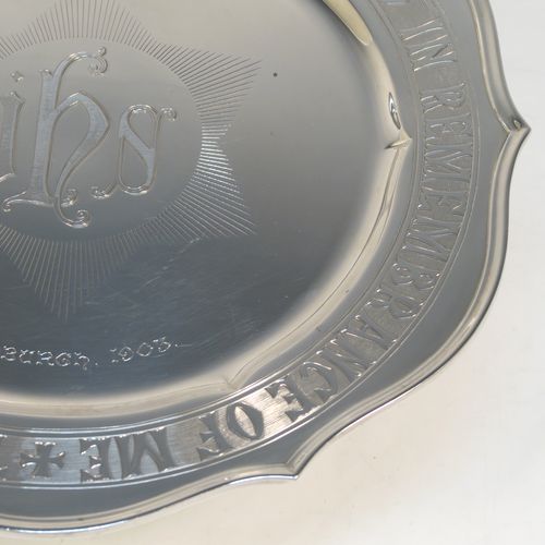 A very handsome and large Antique Edwardian Sterling Silver altar tazza dish for serving the consecrated communion wafers, having a round shaped body with a hand-engraved central Christogram and an engraved border with This Is My Body Which Is Broken For You - This Do In Remembrance Of Me, and all sitting on a plain round pedestal foot. This elegant communion tazza dish was made by Thomas Bradbury of Sheffield in 1902. The dimensions of this fine hand-made antique silver tazza communion dish are diameter 30.5 cms (12 inches), height 11.5 cms (4.5 inches), and it weighs approx. 1,095g (35 troy ounces).