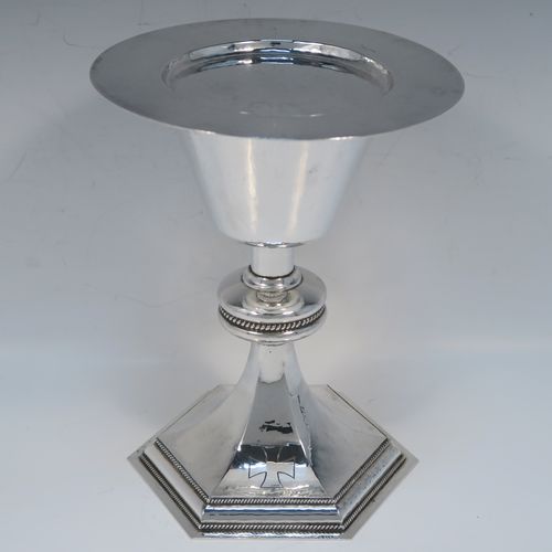 A very handsome Sterling Silver altar chalice and paten, having a round hand-hammered tapering cup with a gold-gilt interior, a middle baluster with an applied rope-twist band, and a spreading hexagonal pedestal foot with applied double rope-twist borders, and the paten with matching hand-hammered decoration. This beautiful silver chalice and paten was made by Hurst, Franklin and Co. Ltd., of London in 1959 (chalice) and 1965 (paten). The dimensions of this fine hand-made silver chalice and paten are height 19.5 cms (7.75 inches), width at base 14 cms (5.5 inches), diameter of paten 15 cms (6 inches), and it weighs approx. 560g (18 troy ounces).   