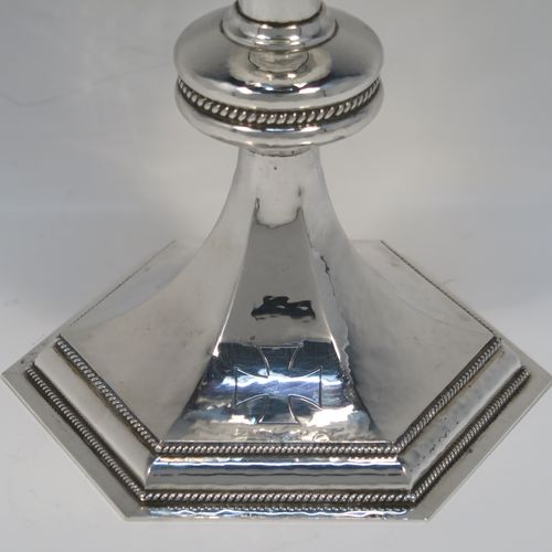 A very handsome Sterling Silver altar chalice and paten, having a round hand-hammered tapering cup with a gold-gilt interior, a middle baluster with an applied rope-twist band, and a spreading hexagonal pedestal foot with applied double rope-twist borders, and the paten with matching hand-hammered decoration. This beautiful silver chalice and paten was made by Hurst, Franklin and Co. Ltd., of London in 1959 (chalice) and 1965 (paten). The dimensions of this fine hand-made silver chalice and paten are height 19.5 cms (7.75 inches), width at base 14 cms (5.5 inches), diameter of paten 15 cms (6 inches), and it weighs approx. 560g (18 troy ounces).
