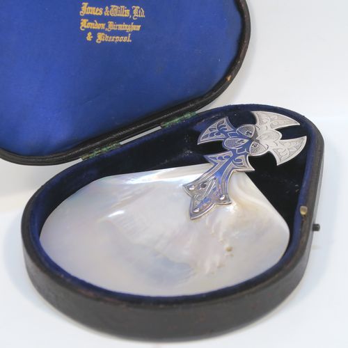 A large and very handsome Antique Sterling Silver and Mother-of-Pearl Anointing or Baptismal holy water Shell, having a silver handle pinned to a shell scoop, with a wonderfully hand-engraved Christoform style handle, and comes with a dark blue satin and velvet-lined presentation box. This beautiful baptism or anointing shell was made by James Willis Ltd., of London in 1920. The dimensions of this fine hand-made silver Baptism or Anointing Shell are length 16.5 cms (6.5 inches), and width 12 cms (4.75 inches).   