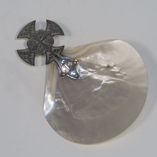 A large and very handsome Antique Sterling Silver and Mother-of-Pearl Anointing or Baptismal holy water Shell, having a silver handle pinned to a shell scoop, with a wonderfully hand-engraved Christoform style handle, and comes with a dark blue satin and velvet-lined presentation box. This beautiful baptism or anointing shell was made by James Willis Ltd., of London in 1920. The dimensions of this fine hand-made silver Baptism or Anointing Shell are length 16.5 cms (6.5 inches), and width 12 cms (4.75 inches).   