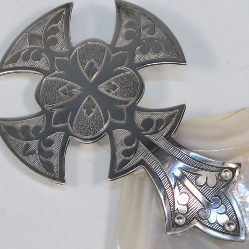 A large and very handsome Antique Sterling Silver and Mother-of-Pearl Anointing or Baptismal holy water Shell, having a silver handle pinned to a shell scoop, with a wonderfully hand-engraved Christoform style handle, and comes with a dark blue satin and velvet-lined presentation box. This beautiful baptism or anointing shell was made by James Willis Ltd., of London in 1920. The dimensions of this fine hand-made silver Baptism or Anointing Shell are length 16.5 cms (6.5 inches), and width 12 cms (4.75 inches).   