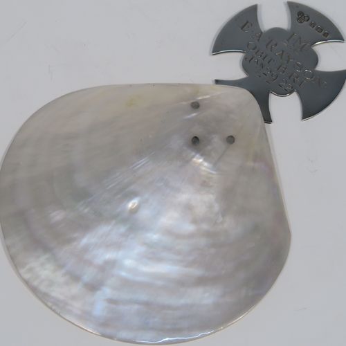 A large and very handsome Antique Sterling Silver and Mother-of-Pearl Anointing or Baptismal holy water Shell, having a silver handle pinned to a shell scoop, with a wonderfully hand-engraved Christoform style handle, and comes with a dark blue satin and velvet-lined presentation box. This beautiful baptism or anointing shell was made by James Willis Ltd., of London in 1920. The dimensions of this fine hand-made silver Baptism or Anointing Shell are length 16.5 cms (6.5 inches), and width 12 cms (4.75 inches).   
