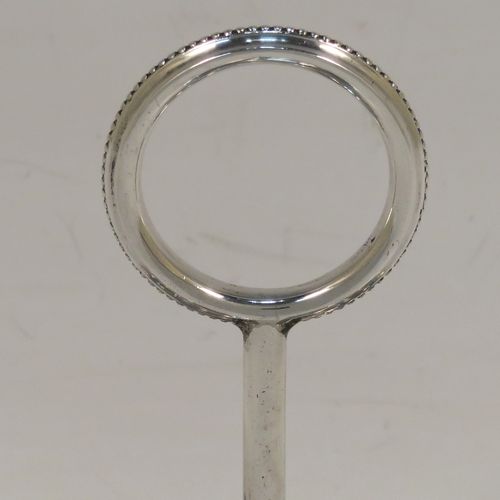 An elegant Antique Victorian Sterling Silver egg cruet or holder set, having three attached plain round bodied egg cups with applied bead-edged borders, and a ring handle above. This handsome antique egg holder was made by Heath and Middleton of London in 1889. The dimensions of this fine hand-made silver egg holder are height 10 cms (4 inches), width 10 cms (4 inches), and it weighs approx. 82g (2.6 troy ounces).