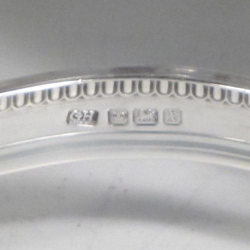 Sterling silver egg cruet set, having four round egg cups, sitting inside a frame with gadroon, shell, and anthemion leaf decoration, and a reeded loop handle, all sitting on four flange feet. Made by George Hancock of Sheffield in 1915. Please note that there are no spoons with this stand. The dimensions of this fine hand-made silver egg cruet set are height 16 cms (6.25 inches), the base is 11 cms (4.3 inches) square and the total weight is approx. 483g (15.6 troy ounces).