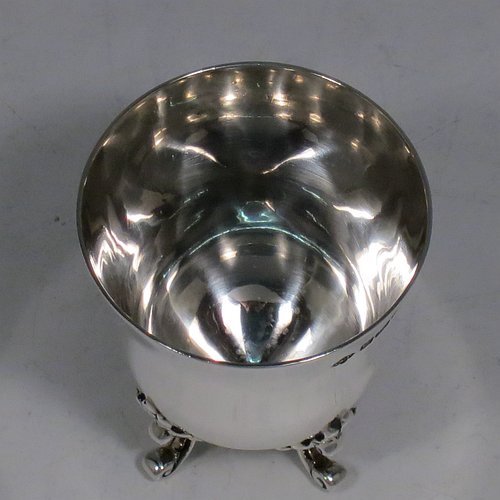 An Antique Edwardian Sterling Silver egg cup, having a plain round body with tapering sides, sitting on four cast foliate feet. Made by Charles Clement Pilling of Sheffield in 1907. The dimensions of this fine hand-made silver egg cup are height 5 cms (2 inches), diameter 4.5 cms (1.75 inches), and it weighs approx. 50g (1.6 troy ounces).