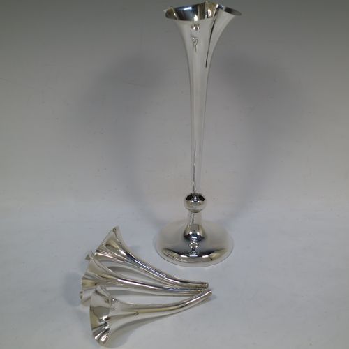 A very pretty Antique Edwardian Sterling Silver Art Nouveau flower vase epergne center-piece, having three removable flower vases and a central larger vase, all with fluted bodies and bead-edged borders, and all sitting on a plain round pedestal foot. All made by John Grinsell of Birmingham in 1905. The dimensions of this fine hand-made antique silver flower epergne are height 24 cms (9.5 inches), and spread across vases 15 cms (6 inches).  