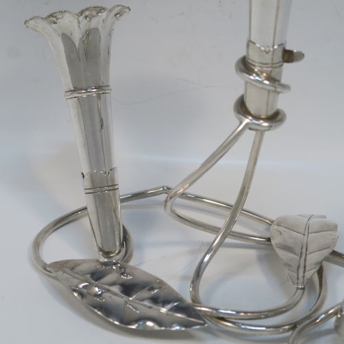 A very pretty Antique Victorian Silver Plated Art Nouveau flower vase epergne center-piece, having three removable flower vases, with a central larger vase, all sitting on a base with wire-work tendrils and leaves. This beautiful centre-piece flower epergne was made in ca. 1890 by Martin Hall and Co., of Sheffield, England. The dimensions of this fine hand-made silver-plated flower epergne are height 25 cms (9.25 inches), and spread across base 20 cms (8 inches).   