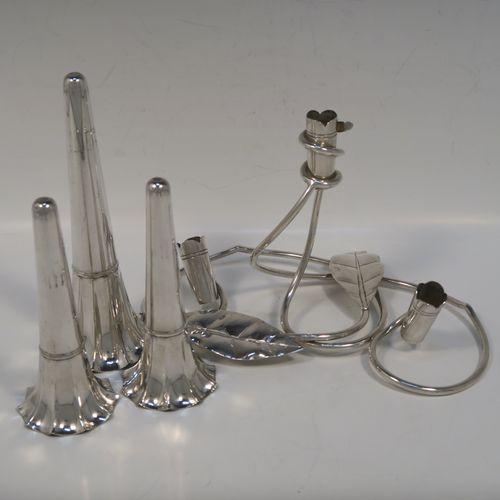 A very pretty Antique Victorian Silver Plated Art Nouveau flower vase epergne center-piece, having three removable flower vases, with a central larger vase, all sitting on a base with wire-work tendrils and leaves. This beautiful centre-piece flower epergne was made in ca. 1890 by Martin Hall and Co., of Sheffield, England. The dimensions of this fine hand-made silver-plated flower epergne are height 25 cms (9.25 inches), and spread across base 20 cms (8 inches).   