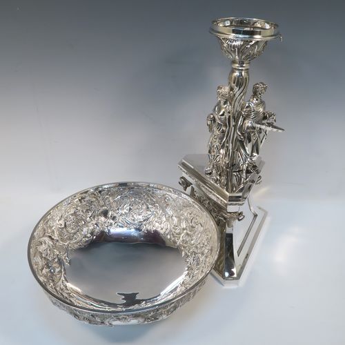 A beautiful and impressive Scottish Antique Victorian Sterling Silver epergne centre-piece, having a top bowl with hand-chased floral, scroll and figural decoration, above a central area consisting of three separate cast caryatid female figures, all sitting on a triangular plinth with tapering sides and applied figural and scroll motifs. This wonderful antique silver centrepiece epergne was made by Marshall and Sons of Edinburgh, Scotland, in 1837. The dimensions of this fine hand-made silver centre-piece are height 47.5 cms (18.75 cms), diameter of bowl 28 cms (11 inches), and it weighs approx. 3,680g (118.7 troy ounces).