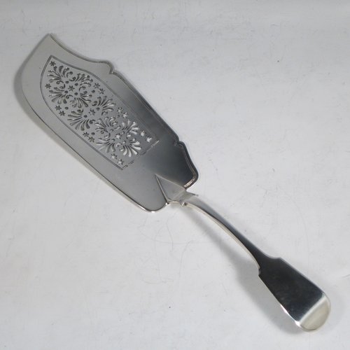 Antique Georgian sterling silver fish server slice, having a plain Fiddle pattern handle, a hand-pierced asymmetrical and curved blade, and a hand-engraved reeded border. Made by William Eley of London in 1830. The dimensions of this fine hand-made silver fish serving slice are length 30 cms (11.75 inches), and it weighs approx. 119g (3.8 troy ounces).   