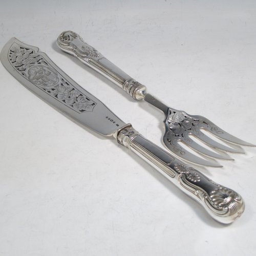 Antique early Victorian sterling silver fish serving knife and fork set, having filled handles in the double-struck Kings pattern, hand-pierced and hand-engraved blade and tines with floral and leaf decoration, the blade with a cartouche engraved with a lady holding a tray of fish. Made by Francis Higgins of London in 1849. The dimensions of this fine hand-made silver fish serving set are length of knife 33 cms (13 inches), and length of fork 24 cms (9.5 inches). Please note that the handles have a number of small dents, but are otherwise in very good condition.  