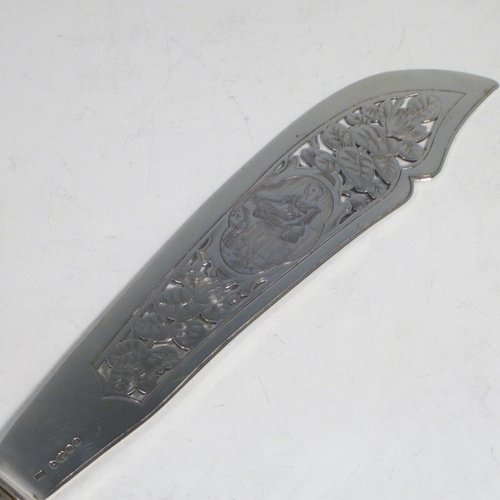 Antique early Victorian sterling silver fish serving knife and fork set, having filled handles in the double-struck Kings pattern, hand-pierced and hand-engraved blade and tines with floral and leaf decoration, the blade with a cartouche engraved with a lady holding a tray of fish. Made by Francis Higgins of London in 1849. The dimensions of this fine hand-made silver fish serving set are length of knife 33 cms (13 inches), and length of fork 24 cms (9.5 inches). Please note that the handles have a number of small dents, but are otherwise in very good condition.
