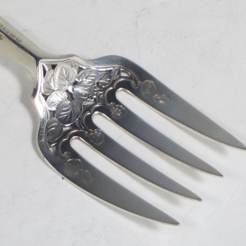 Antique early Victorian sterling silver fish serving knife and fork set, having filled handles in the double-struck Kings pattern, hand-pierced and hand-engraved blade and tines with floral and leaf decoration, the blade with a cartouche engraved with a lady holding a tray of fish. Made by Francis Higgins of London in 1849. The dimensions of this fine hand-made silver fish serving set are length of knife 33 cms (13 inches), and length of fork 24 cms (9.5 inches). Please note that the handles have a number of small dents, but are otherwise in very good condition.